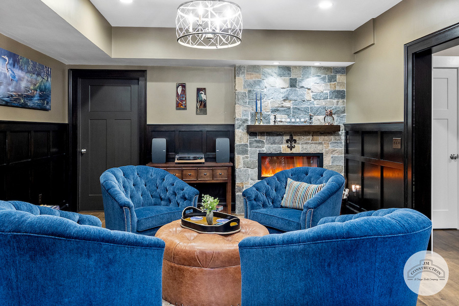 Speakeasy with fireplace by JM Construction