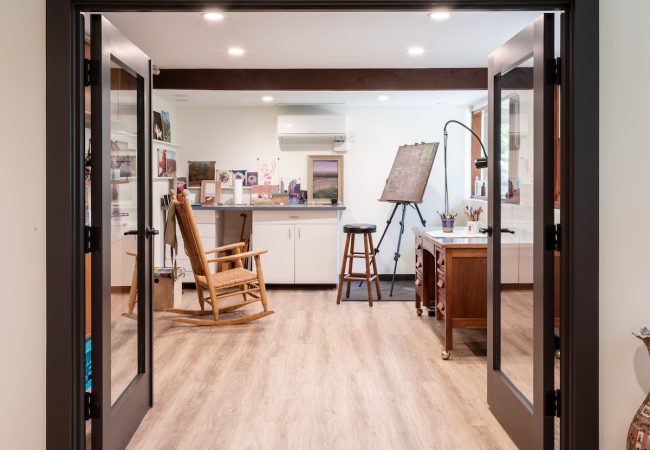 Finished basement with open double doors and extra multipurpose room (JM Construction)