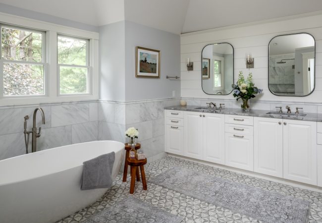 Updated bathroom with freestanding tub, double sinks, and full vanity (JM Construction)